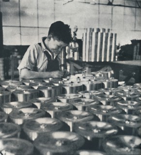 'Apprentice with microscope (testing the hardness of pistons)', 1941. Artist: Cecil Beaton.