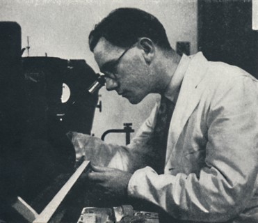'Research worker with microscope (testing the structure of an aluminium alloy)', 1941. Artist: Cecil Beaton.