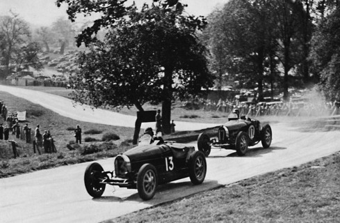 'Thrilling racing in rural England: Bugattis at Donington', 1937. Artist: Unknown.