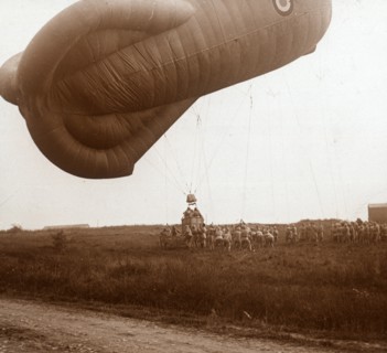 Raising of barrage balloon with basket for observation, c1914-c1918. Artist: Unknown.