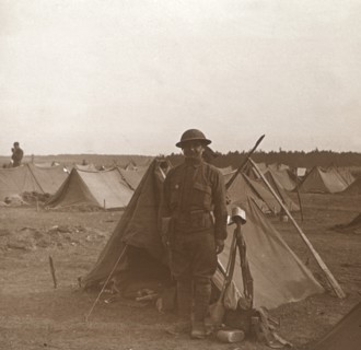 Soldier standing by tent, American camp, Melette, France, c1914-c1918.  Artist: Unknown.