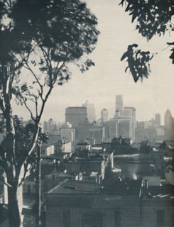 'Dwellings of Homely Timber in the Shadow of Concrete Giants', c1935. Artist: Unknown.