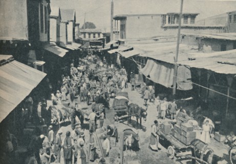 'Chaffering Oriental Crowds That Throng The Street Markets', c1935. Artist: Charles H Gabriel.