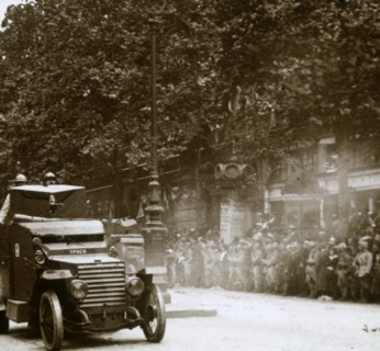 Machine gun mounted in armoured vehicle, victory parade, c1918. Artist: Unknown.