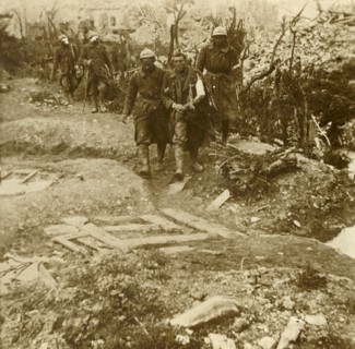 Wounded French infantrymen arriving at Chateau d'Esnes, Verdun, northern France, 1916. Artist: Unknown.