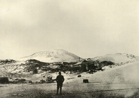 'The Hut, with Mount Erebus in the Background, in the Autumn', 1908, (1909).  Artist: Unknown.