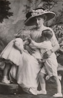 'Queen Victoria of Spain with Prince Alfonso, Princess Maria Christina and Princess Beatrice, 1911.  Creator: Frank Arthur Swaine.