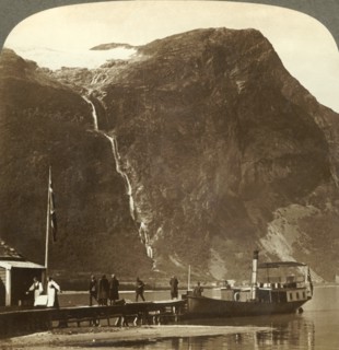 'Utigards Falls from Ravnefjeld glacier at Lake Loen - from Naesdal, Norway', c1905. Creator: Unknown.