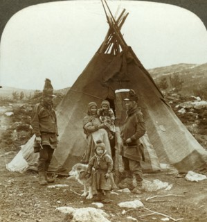 'Laplander family and sledge dog - outside their summer home - on a hillside in Norway', c1905. Creator: Unknown.
