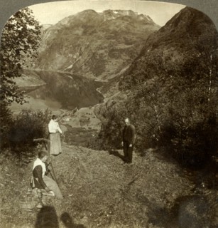 'Haying on mountain shelf high above Marok village and mirror-clear Geirangerfjord, Norway', c1905 Creator: Unknown.