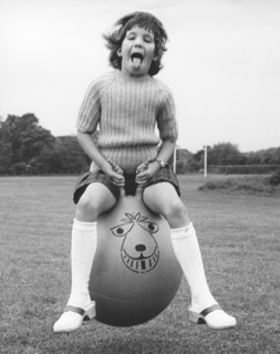 Girl on a space hopper, 1970s.