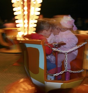 Children on a fairground ride, 2005