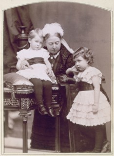 Queen Victoria with two of her grandchildren, April 1886. Artist: Alexander Bassano