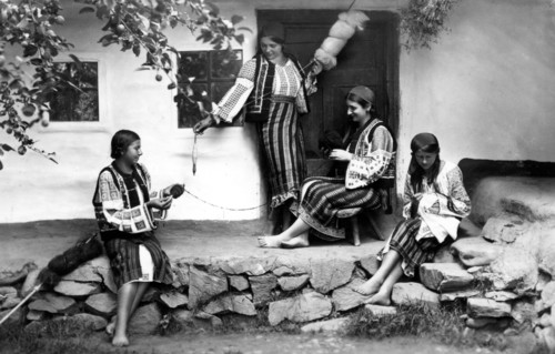 Young women spinning and sewing, Bistrita Valley, Moldavia, north-east Romania, c1920-c1945. Artist: Adolph Chevalier