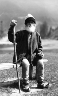 Old man sitting on a bench, Bistrita Valley, Moldavia, north-east Romania, c1920-c1945. Artist: Adolph Chevalier