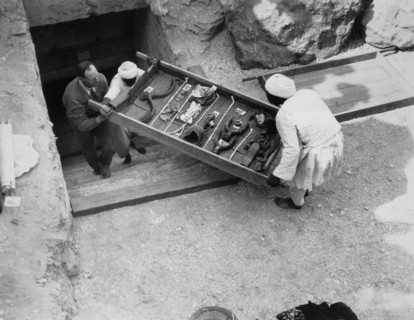 Removing a tray of chariot parts from the Tomb of Tutankhamun, Valley of the Kings, Egypt, 1922. Artist: Harry Burton