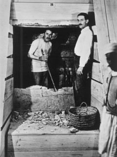 Howard Carter and a colleague excavating a tomb in the Valley of the Kings, Egypt, 1922. Artist: Harry Burton