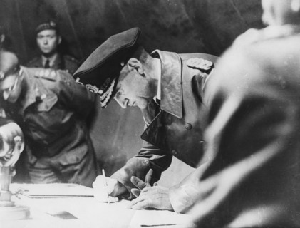 Rear-Admiral Gerhard Wagner signing the German surrender document ending World War II, 1945. Artist: Unknown