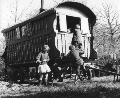 Gypsy children playing outside their caravan, 1960s.
