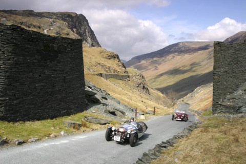 Vintage cars climbing Honister Pass, Lake District, Cumbria.