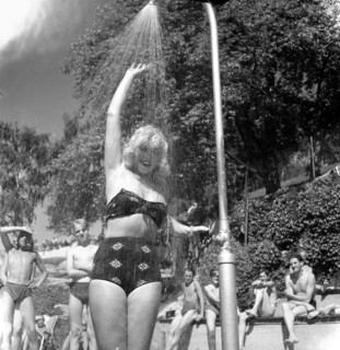 A refreshing shower during the heatwave in Stockholm, Sweden, 24th July 1943. Artist: Karl Sandels
