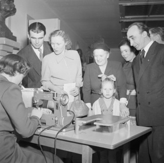 A woman demonstrates a sewing machine, Landskrona, Sweden, 1951. Artist: Unknown