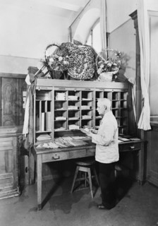 Postman sorting mail at the post office, Landskrona, Sweden, 1940. Artist: Unknown