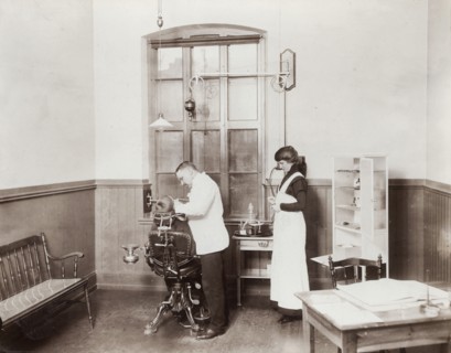 A dentist and his nurse give a schoolboy his treatment, 1910s. Artist: Unknown