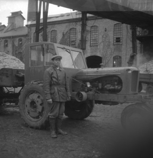 Man with a tractor at the sugar mill in Arlöv, Scania, Sweden, c1940s(?). Artist: Otto Ohm