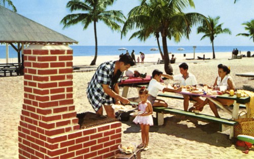 A family enjoying a picnic and barbecue on a sandy beach in Florida, USA, 1957. Artist: Unknown