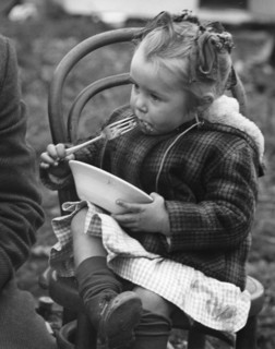 Gypsy girl eating, 1960s.