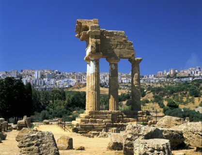 Temple of Diosuri, Agrigento, Sicily, Italy. Agrigento town behind.