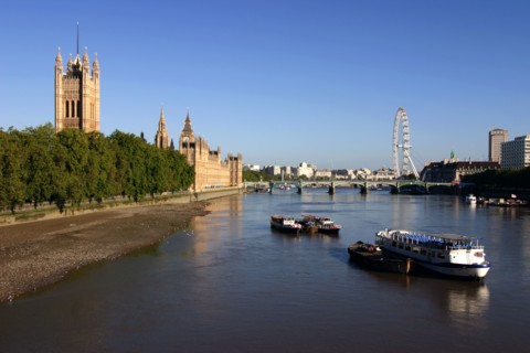 River Thames, Houses of Parliament and The London Eye, London.