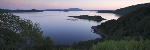 View over Seil Sound to a salmon farm and Luing, Slate Islands, Argyll and Bute, Scotland.