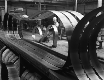 Giant bandsaw blades, Slack Sellers & Co, Sheffield, South Yorkshire, 1963.  Artist: Michael Walters