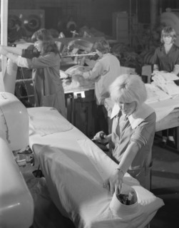 Shirt pressing at a commercial laundry in Scunthorpe, Lincolnshire, 1965.  Artist: Michael Walters