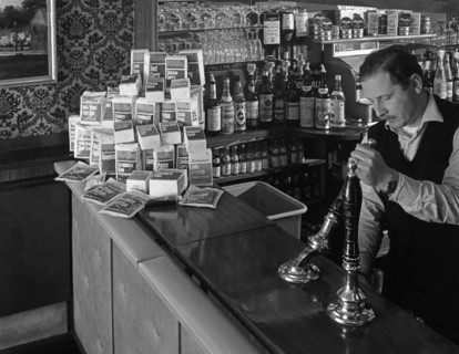 A pub landlord with a display of the Batchelors 5 day catering pack on his bar, 1968. Artist: Michael Walters