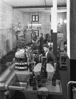 The final stages of bottling whisky at Wiley & Co, Sheffield, South Yorkshire, 1960.  Artist: Michael Walters