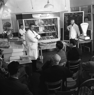 Butcher from Danish Bacon giving a demonstration, Kilnhurst, South Yorkshire, 1961.  Artist: Michael Walters
