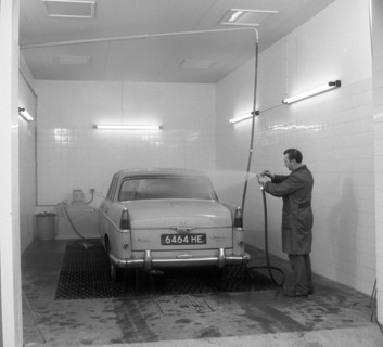 A 1961 Austin Westminster in a car wash, Grimsby, 1965.  Artist: Michael Walters