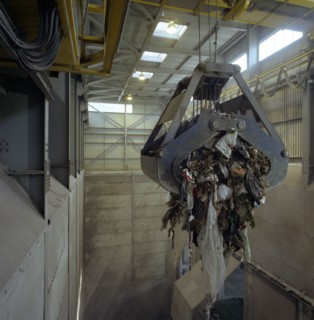 Waste ready for incineration in giant crane grab jaws, St Helier, Jersey, 1980.  Artist: Michael Walters