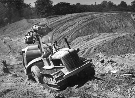 Tractor unit pulling an earth grading machine at a site near Rotherham, South Yorkshire, 1954. Artist: Michael Walters