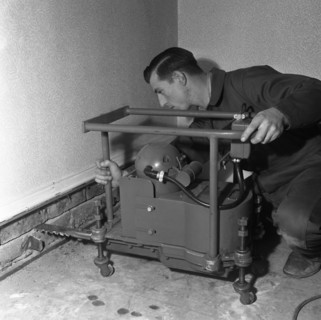 Installing a damp proof course in a house in Goldthorpe, South Yorkshire, 1957.  Artist: Michael Walters