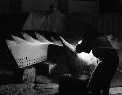 Welding a dragline bucket, Edgar Allen Steel Co, Sheffield, South Yorkshire, 1962. Artist: Michael Walters