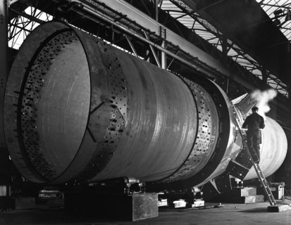 A rotary kiln section being welded in preparation for installation, Steetley, Nottinghamshire, 1962. Artist: Michael Walters
