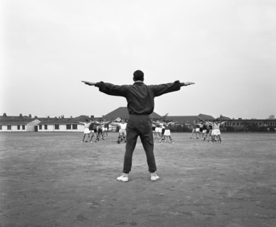 Games master taking a gym class, Airedale school, Castleford, West Yorkshire, 1962. Artist: Michael Walters