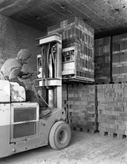 A yardsman stacking pallets of bricks, Whitwick Brickworks, Coalville, Leicestershire, 1963. Artist: Michael Walters