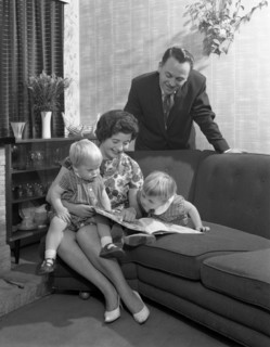 Family group looking at a brochure, Doncaster, South Yorkshire, 1963. Artist: Michael Walters