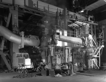 Charging an electric arc furnace, Park Gate Iron & Steel Co, Rotherham, South Yorkshire, 1964. Artist: Michael Walters