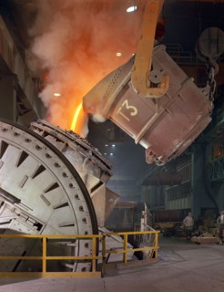 Pouring molten iron into a Kaldo unit, Park Gate Iron & Steel Co, Rotherham, South Yorkshire, 1964. Artist: Michael Walters